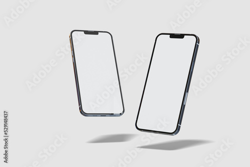Two floating smartphones with blank screen photo