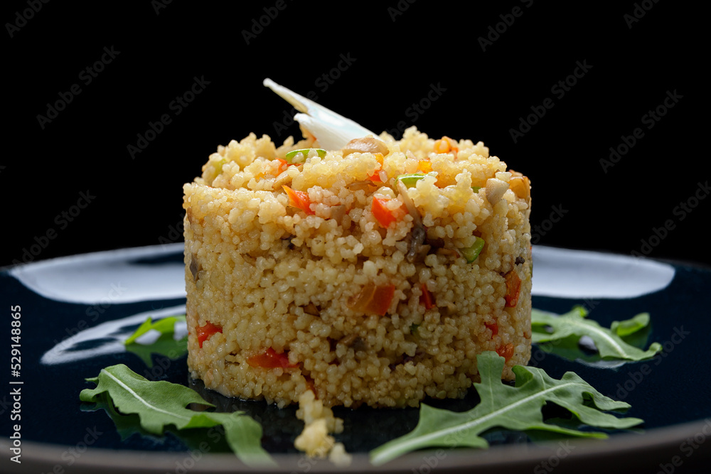 Couscous porridge with vegetables, butter and herbs Couscous porridge with vegetables, butter and herbs