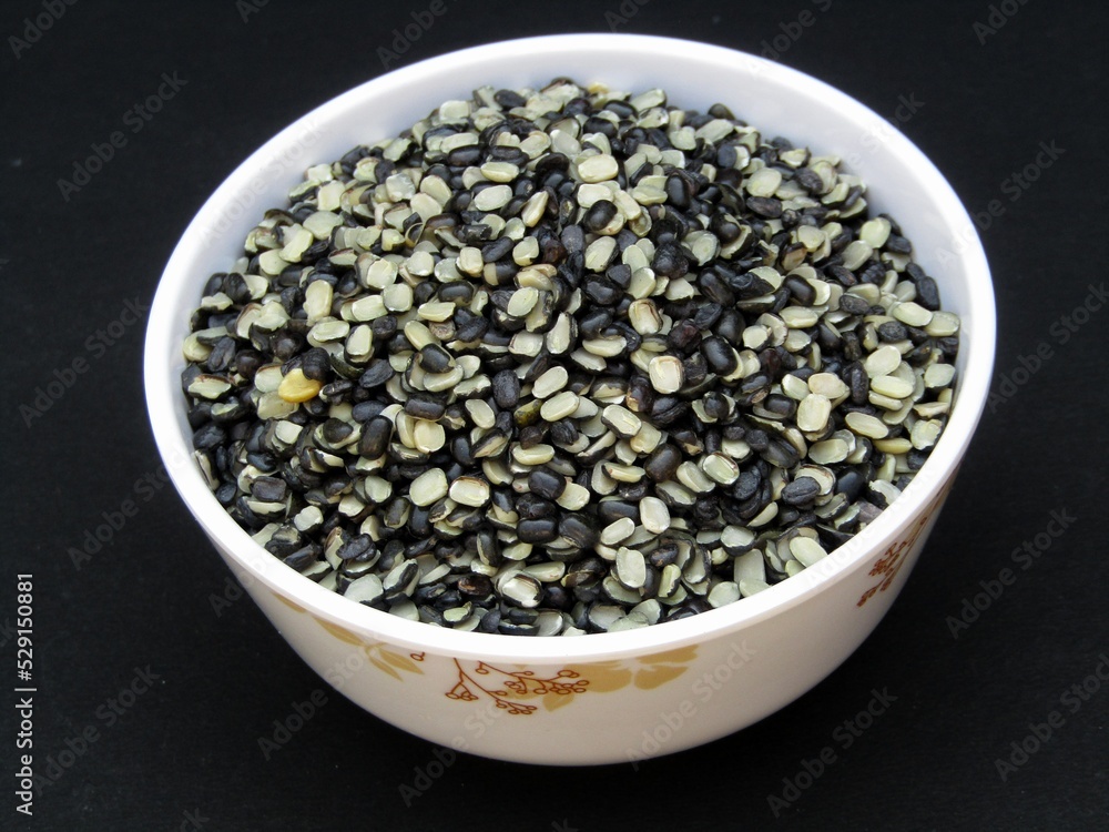 Broken Vigna mungo or black gram in a bowl Broken Vigna mungo or black gram in a bowl