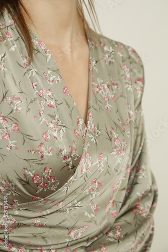 Serie of studio photos of young female model wearing floral silk satin wrap blouse  © triocean