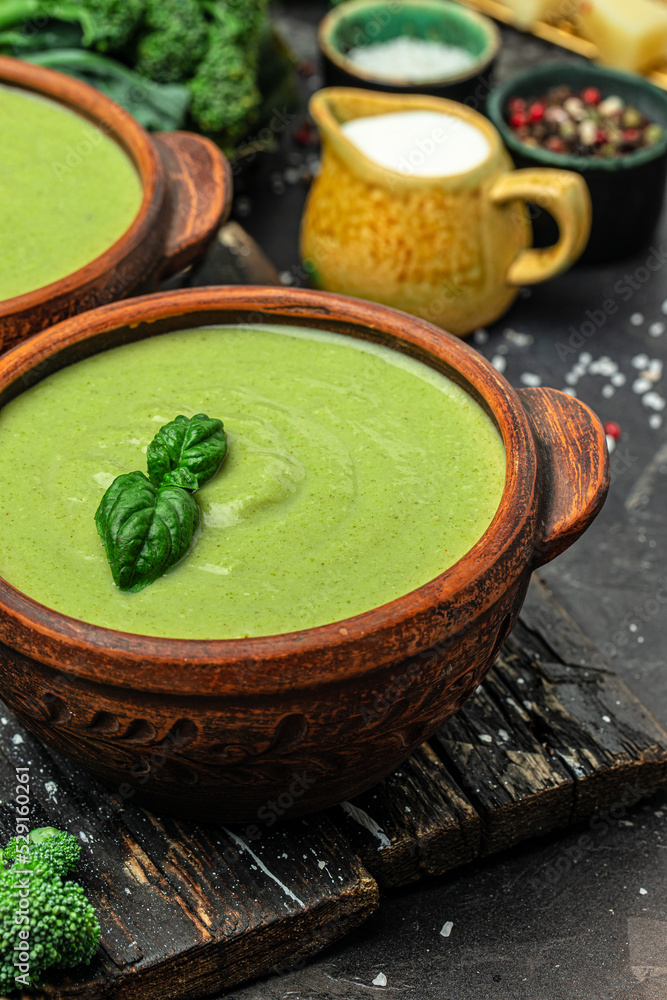 delicious broccoli soup with basil and cream, Diet detox food concept, vertical image. top view. place for text delicious broccoli soup with basil and cream, Diet detox food concept, vertical image. top view. place for text