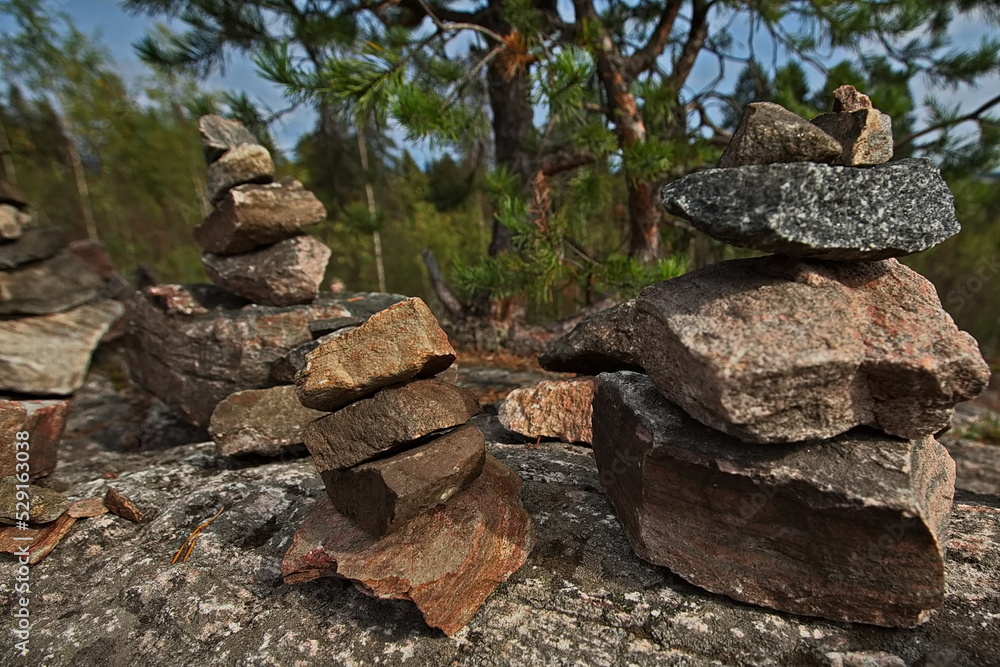 Stone pyramids built by tourists on Mount Kuhovuori Stone pyramids built by tourists on Mount Kuhovuori