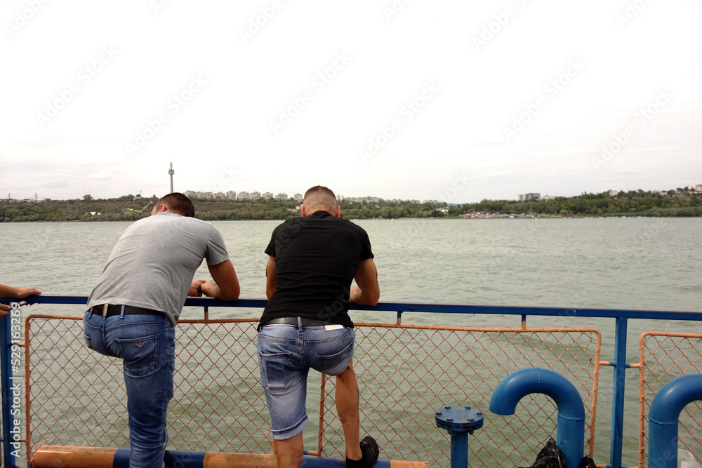 Fototapeta premium two man on a ship on danube river