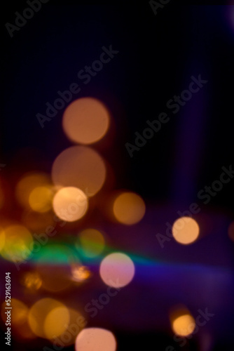 Diffrent golden bokeh on dark background with colorful stripes. Abstract, Festive, Christmas and party design