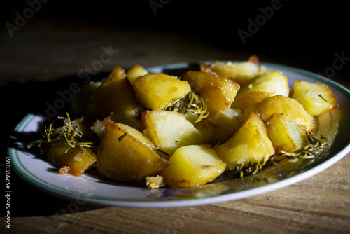 baked potatoes with chiaroscuro light photo