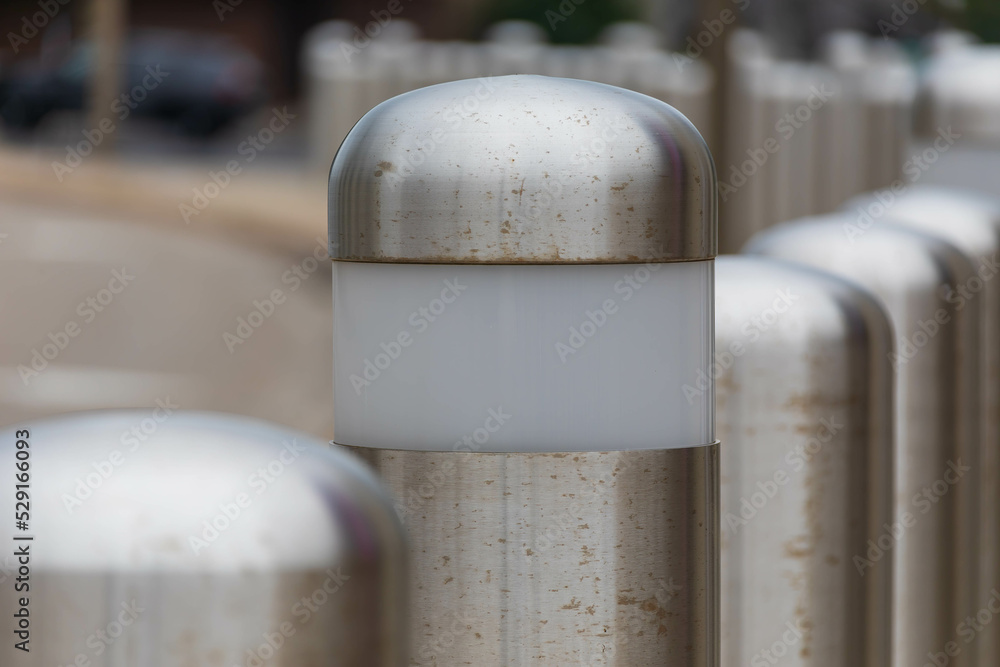 some of the barriers in this row of traffic barriers have lights in them for night time safety some of the barriers in this row of traffic barriers have lights in them for night time safety