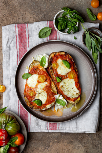 Baked eggplant with mozzarella cheese, tomatoes and basil