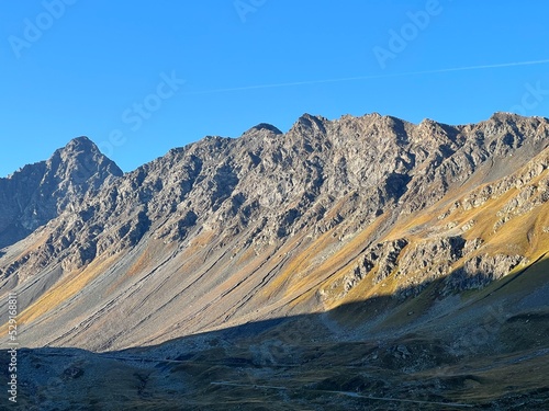 Rocky alpine peaks Schwarzhorn (3145 m) and Chlein Schwarzhorn (2967 m) in the Albula Alps mountain range, Davos - Canton of Grisons, Switzerland (Kanton Graubünden, Schweiz) photo