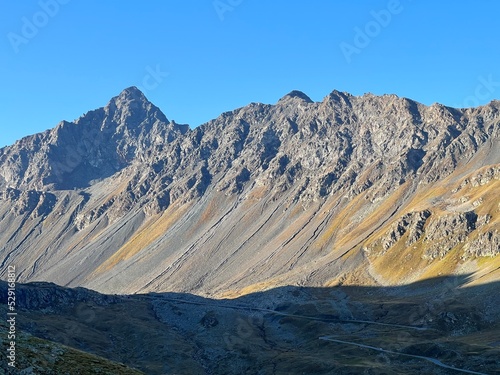 Rocky alpine peaks Schwarzhorn (3145 m) and Chlein Schwarzhorn (2967 m) in the Albula Alps mountain range, Davos - Canton of Grisons, Switzerland (Kanton Graubünden, Schweiz) photo