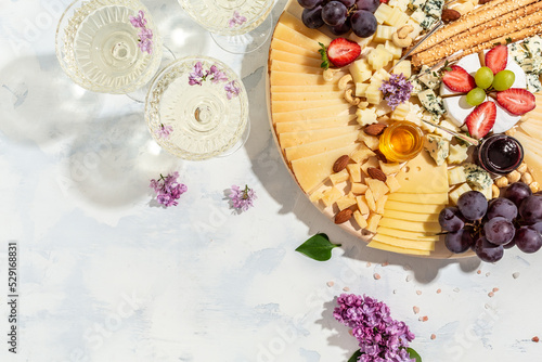 Antipasto platter of various types of soft and hard cheese Fototapeta