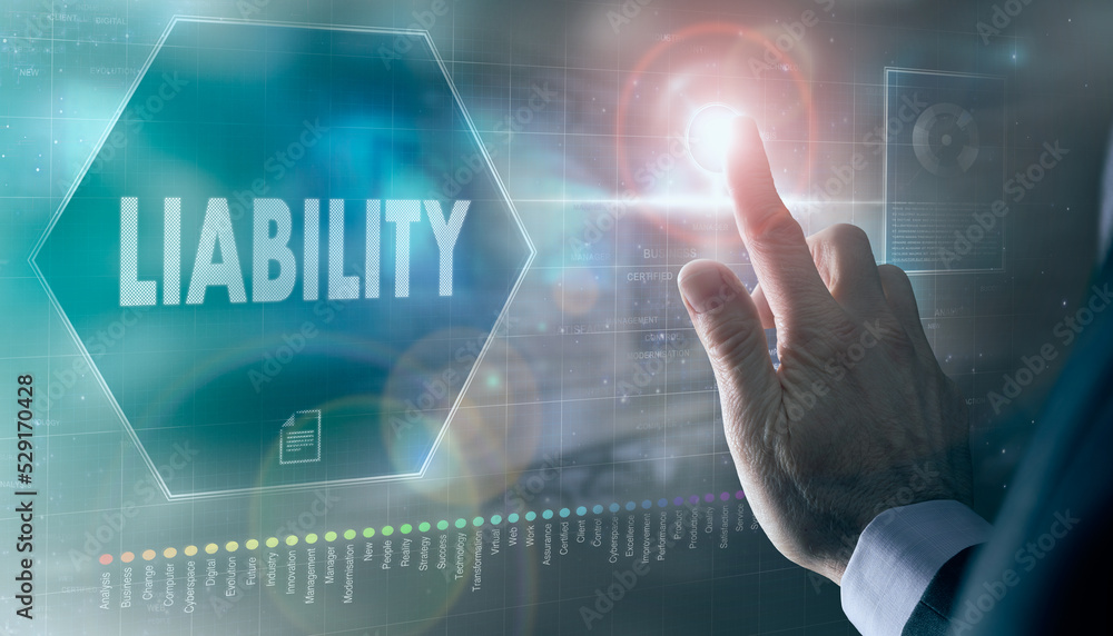 A businessman controlling a futuristic display with a Liability business concept on it.