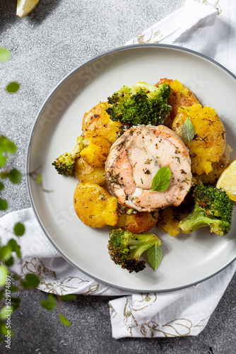 salmon medallions with broccoli and baked potatoes