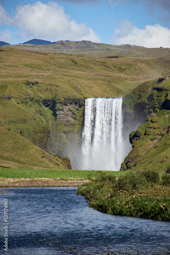 Skogafoss waterfall and river in green landscape  Sk  gar  Iceland.