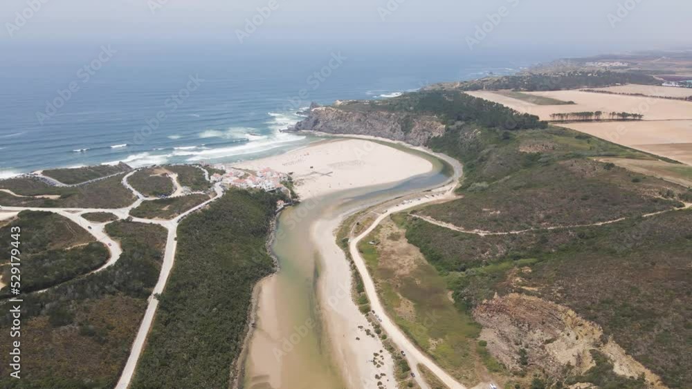 Aerial view of Praia de Odeceixe, a beautiful beach facing the Atlantic Ocean in Alentejo region, Portugal. Aerial view of Praia de Odeceixe, a beautiful beach facing the Atlantic Ocean in Alentejo region, Portugal.