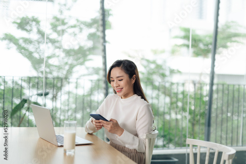 young woman commenting in social network app, communicating with subscribers