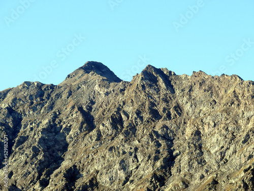 Rocky alpine peak Chlein Schwarzhorn (2967 m) of the Albula Alps mountain range in the Swiss Alps massif, Davos - Canton of Grisons, Switzerland (Kanton Graubünden, Schweiz) photo