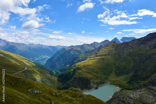 Fototapeta Naklejka Na Ścianę i Meble -  View of mountain ranges in High Tauern mountains with the Stausee Margaritze lake bellow in Carinthia, Asutria