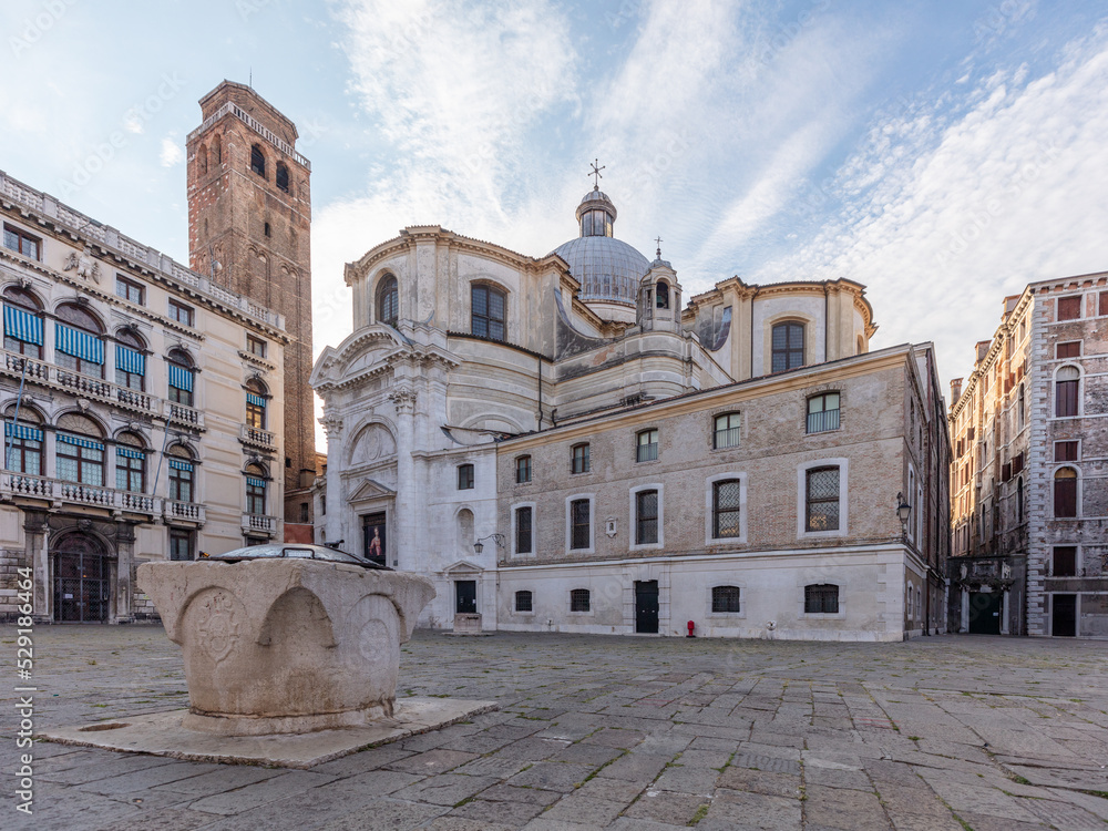 Fototapeta premium Church Santa maria della salute behind some old venetian buildings in Venice, Italy.