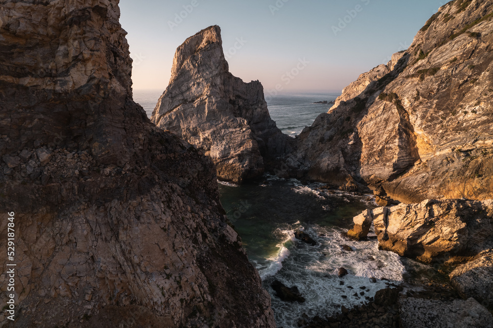 Sea waves against rocks in morning