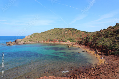 Cala Rotja (Menorca). Pequeña playa virgen de aguas turquesa y cristalinas junto a la playa de Cavalleria, en el norte de la isla de Menorca (Islas Baleares, España) photo