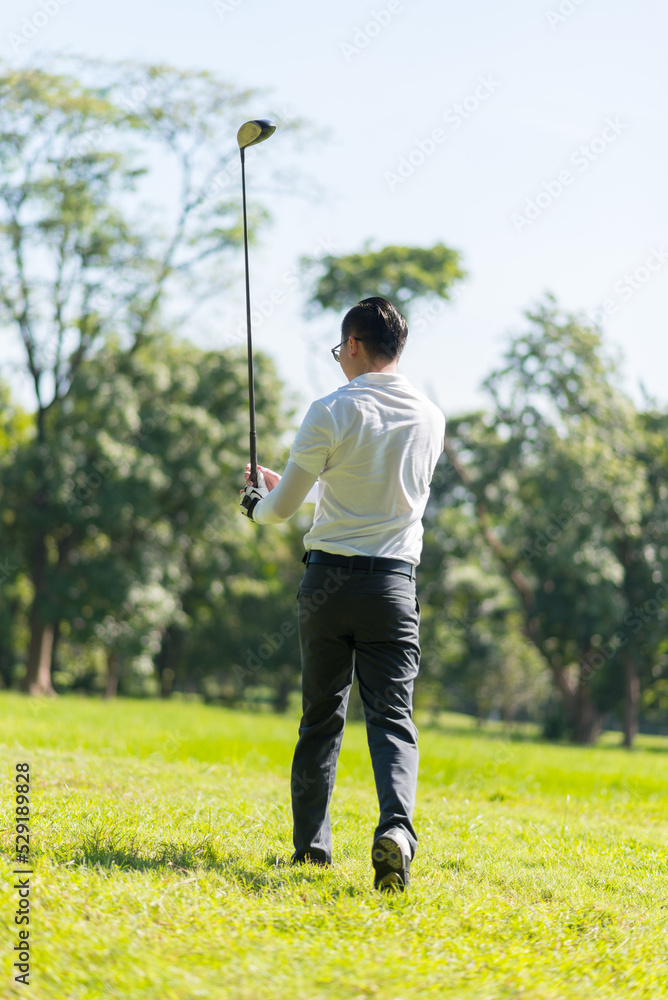 Close up professional golf player with club on course Close up professional golf player with club on course