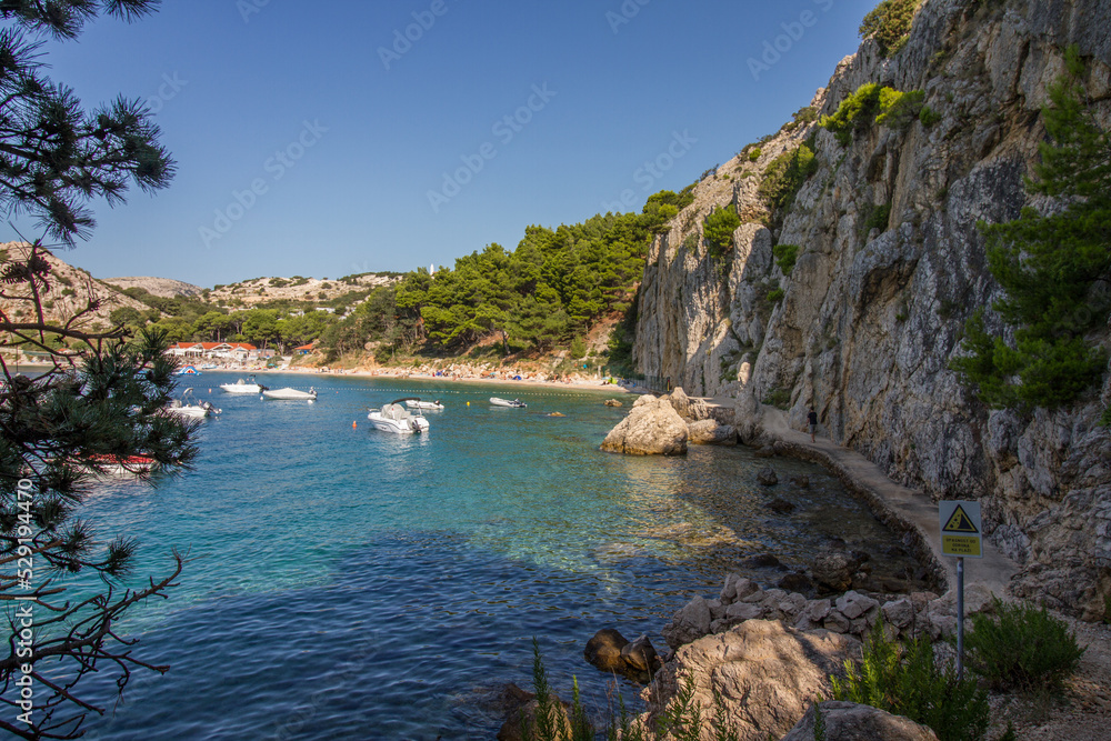 Beautiful seascape of rocky coast and clear waters with rocky bay of the Mediterranean Sea near Baska at the island of Krk, Croatia