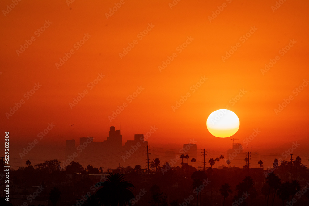 The Sun rises over Los Angeles, California, USA during a dangerous heat wave that has been straining the power grid and causing electrical shortages through Southern California