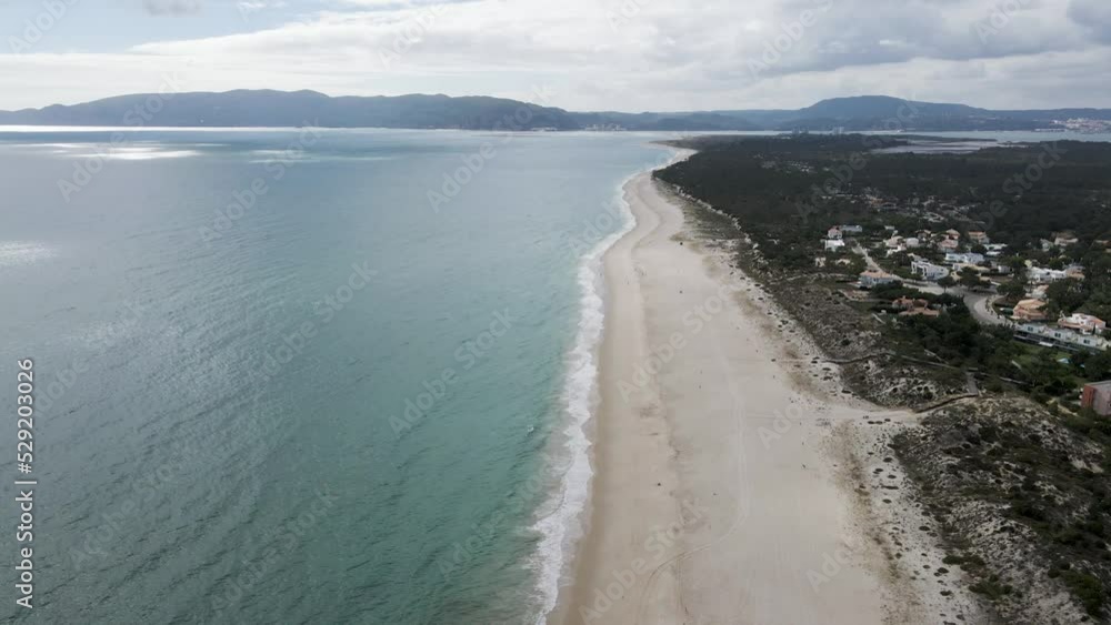 Aerial view of Troia Peninsula between the Atlantic Ocean and a river estuary at sunset, Setubal, Portugal. Aerial view of Troia Peninsula between the Atlantic Ocean and a river estuary at sunset, Setubal, Portugal.