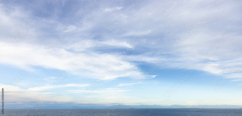 Cloudy Cloudscape during sunny summer Day on the West Coast of Pacific Ocean. British Columbia, Canada. Sunset Sky