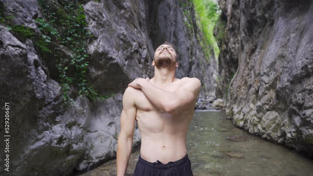 Young man exercising in nature.
Exercise movements in the stream. Sporty man doing stretching exercises.
Young man exercising in nature.
Exercise movements in the stream. Sporty man doing stretching exercises.