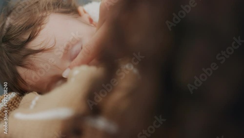 Breastfeeding, baby and mother feeding her tired, sleepy and healthy infant child. Love, care and nurture with parent giving sucking kid breast milk for health, nutritient and growth at home