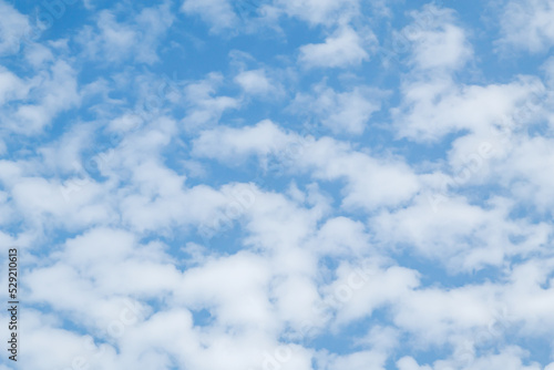 Blue sky with cumulus clouds at daytime. Natural panoramic background photo texture