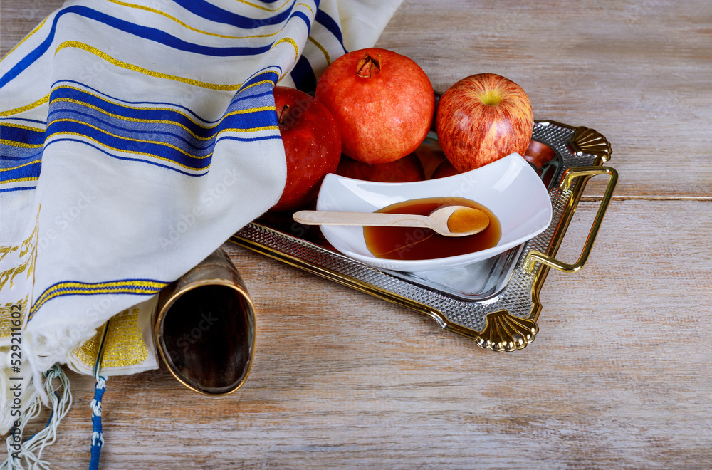 Rosh Hashanah traditional symbols Jewish New Year holiday apples, honey, pomegranate with ritual