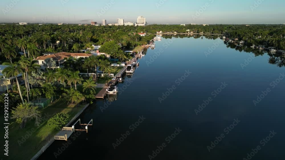 Aerial view of luxury waterfront homes and mansions on a lake in South Florida