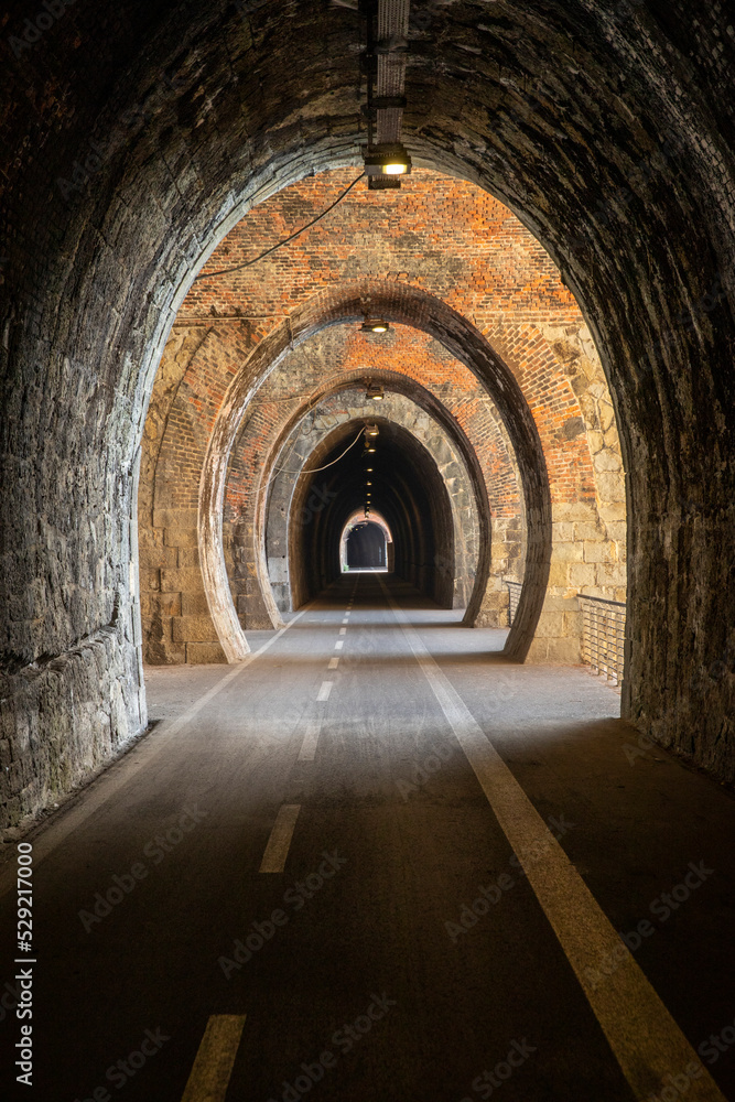 Cycle path in Liguria built on the old train route. Tunnel made from red bricks