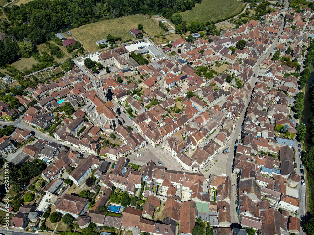 Aerial view above the beautiful french village of Noyers during summer