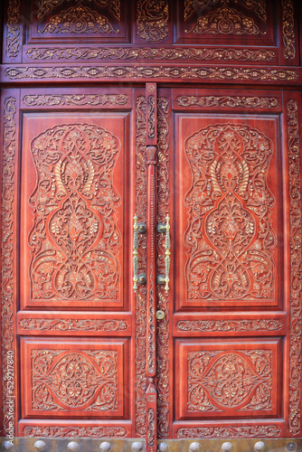 Beautiful red wooden door with cavering