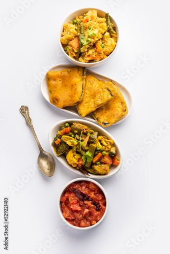 Bengali Bhog food for Indian Hindu Durga Puja or pooja festival. Khichadi, labra, tomato chutney