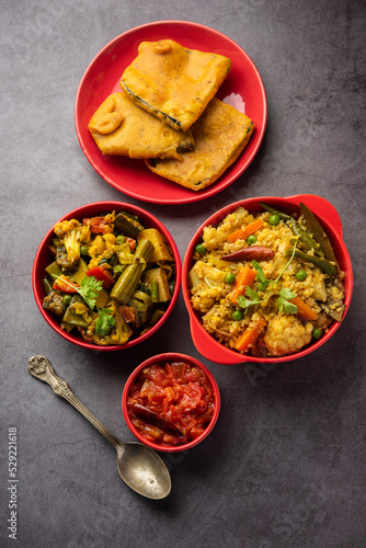 Bengali Bhog food for Indian Hindu Durga Puja or pooja festival. Khichadi, labra, tomato chutney photo