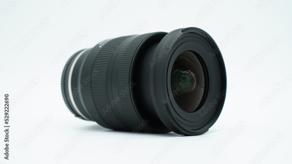 Wide angle camera lens lying isolated on a white background.