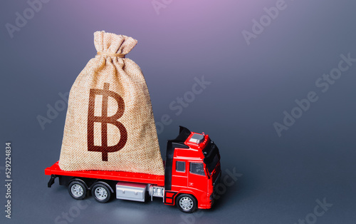 Truck with a thai baht money bag Fototapeta
