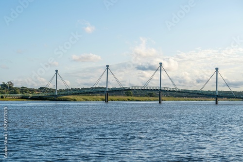 Φωτογραφία Bridge over the river Sado with a background of trees and fields