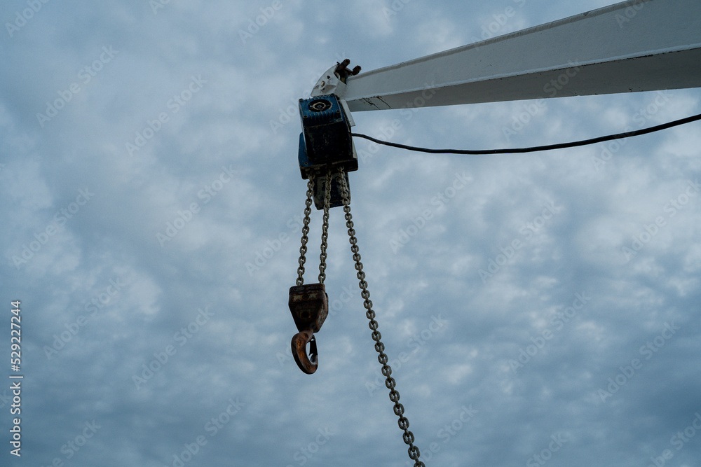 Tap. Hoisting crane with hook. Close-up
