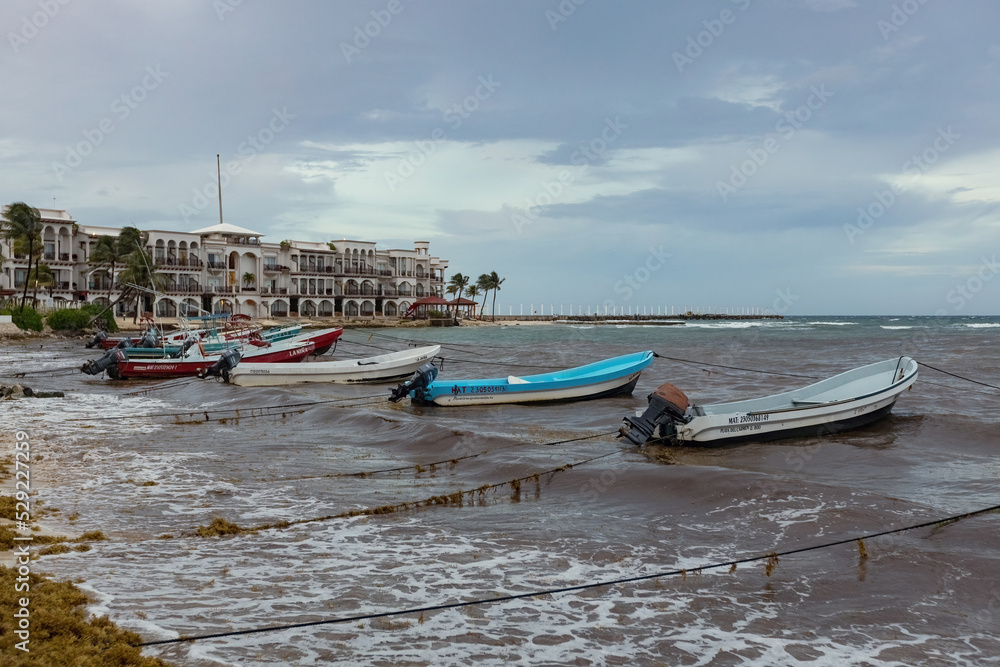 Boats on the water, stormy sea in Playa del Carmen, Mexico Boats on the water, stormy sea in Playa del Carmen, Mexico