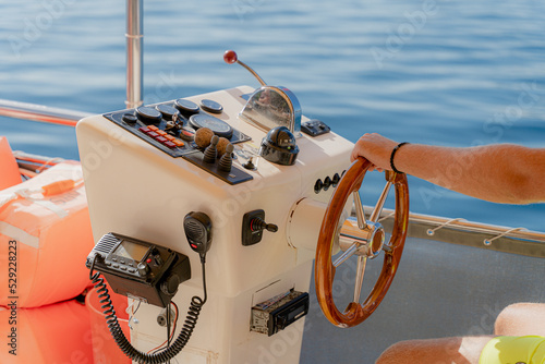 Steering wheel. The steering wheel in the boat.