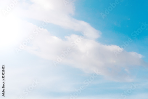 Bright sun in a blue sky with Clouds © Baurzhan I