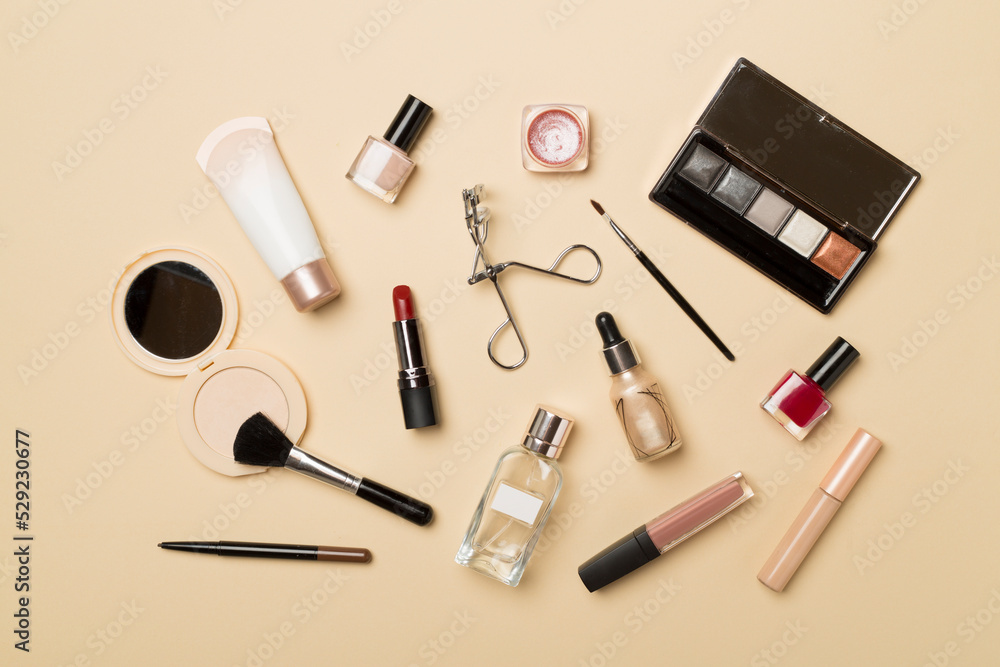 Obraz premium Different makeup products on color background, top view