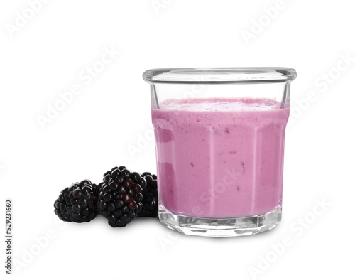 Delicious blackberry smoothie in glass and berries on white background