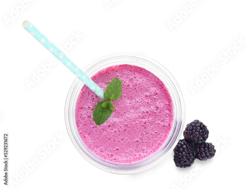 Glass of blackberry smoothie with straw and mint isolated on white, top view