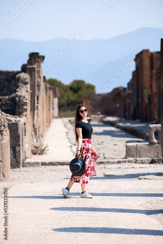 Travel photo of woman amongs some ancient ruins © Sved Oliver